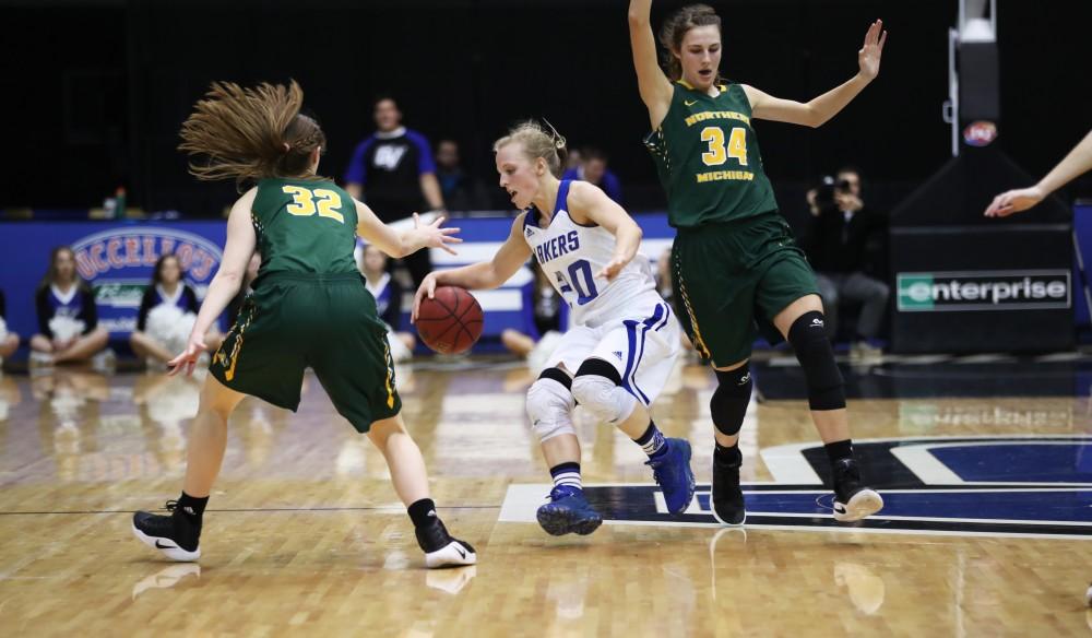 GVL/Kevin Sielaff - Janae Langs (20) jukes her way down the court during the game against Northern Michigan on Saturday, Feb. 18, 2017 inside the Fieldhouse Arena in Allendale.