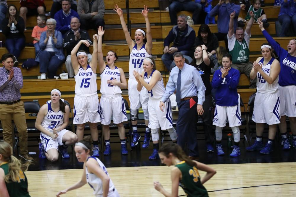 GVL/Kevin Sielaff - The Lakers celebrate a three point shot during the game against Northern Michigan on Saturday, Feb. 18, 2017 inside the Fieldhouse Arena in Allendale.