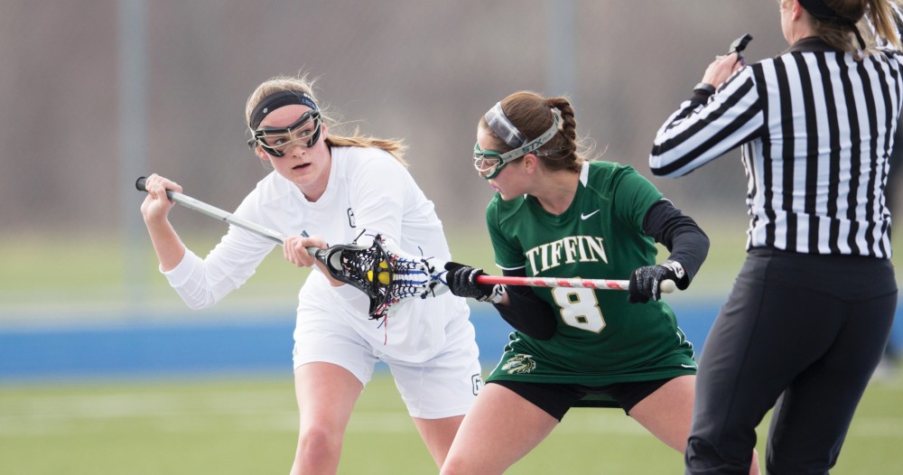 GVL / Kevin Sielaff – Meghan Datema (18) takes a face-off at mid-field. The Lakers take the victory over Tiffin University Friday, April 1, 2016.