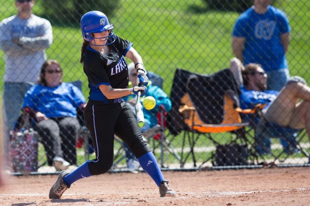 GVL / Kevin Sielaff – Shannon Flaherty (19) makes contact with the ball and runs to first base. Grand Valley takes the victory over Walsh in both games held in Allendale on Saturday, April 23, 2016.