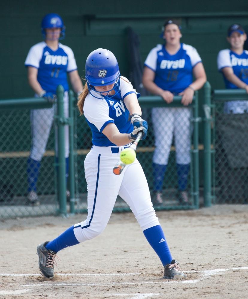 GVL / Kevin Sielaff - Jenna Lenza (4) hits the ball high and down field. Grand Valley State squares off against Wayne State in the second game of the Midwest Super Regional tournament. The Lakers came out with the victory with a final score of 1-0 on Thursday, May 12, 2016 in Detroit, MI. 