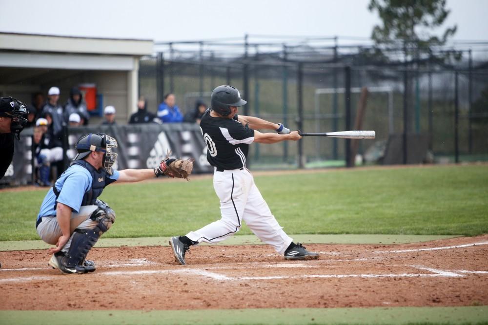 GVL / Emily Frye    
Junior Johnny Nate smacks the ball against Northwood University on Wednesday April 13, 2016.