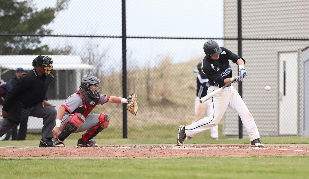 GVL/Kevin Sielaff - Anthony Villar (17) cracks a base hit during the game vs. Lewis University on Wednesday, March 29, 2017. 