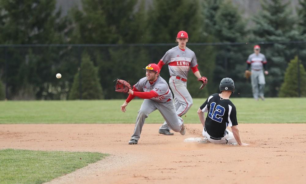 GVL/Kevin Sielaff - Alex Young (12) steals second base during the game vs. Lewis University on Wednesday, March 29, 2017. 