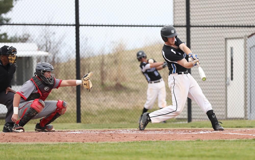 GVL/Kevin Sielaff - Alex Young (12) slices a foul ball during the game vs. Lewis University on Wednesday, March 29, 2017. 