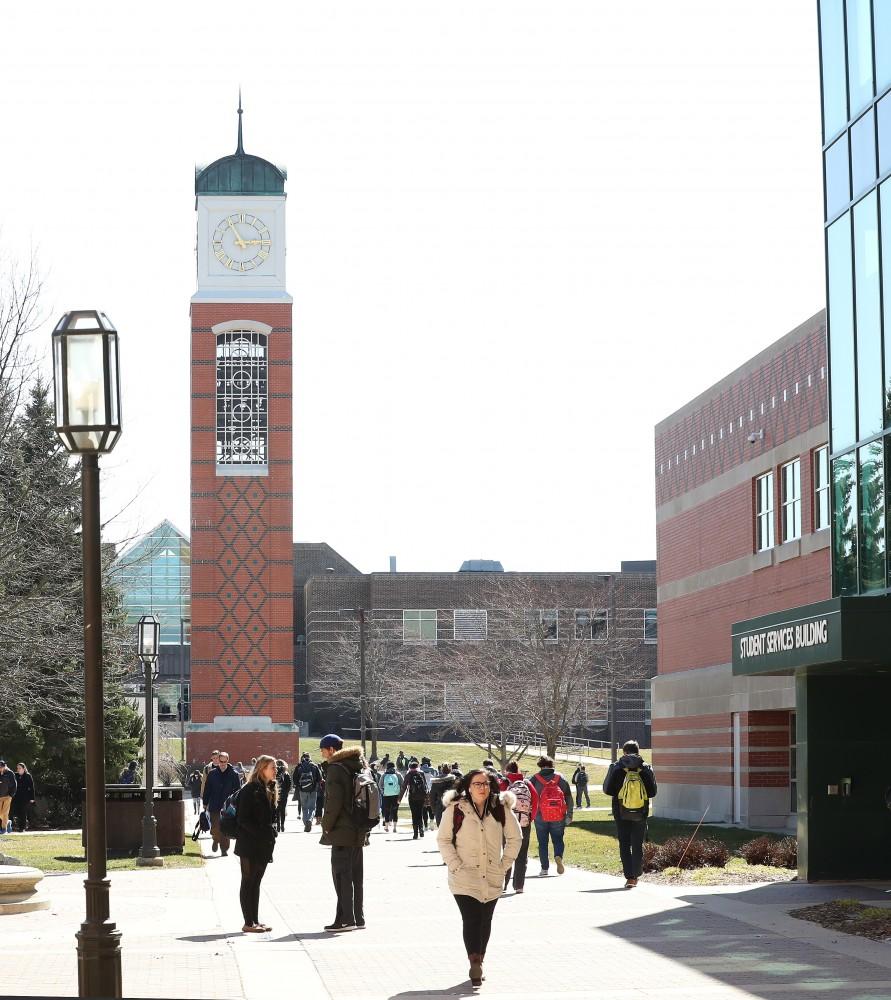 GVL/Kevin Sielaff - Students walk around Grand Valley's Allendale campus on Wednesday, Mar. 22, 2017.