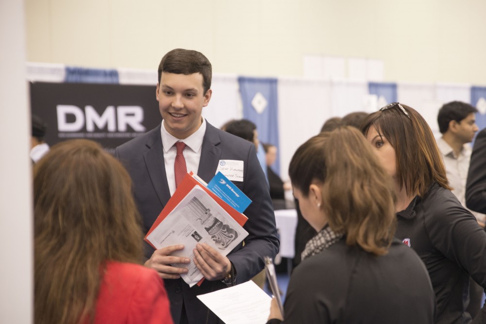 GVL / Luke Holmes - Jeff Kawaski talks to potential employers. The Career Fair was held in the DeVos Place on Thursday, Feb. 23, 2016.