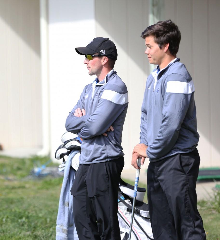 GVL / Kevin Sielaff - Head coach Gary Bissell instructs Domenic Mancinelli April 29 at the Meadows Golf Course in Allendale. 