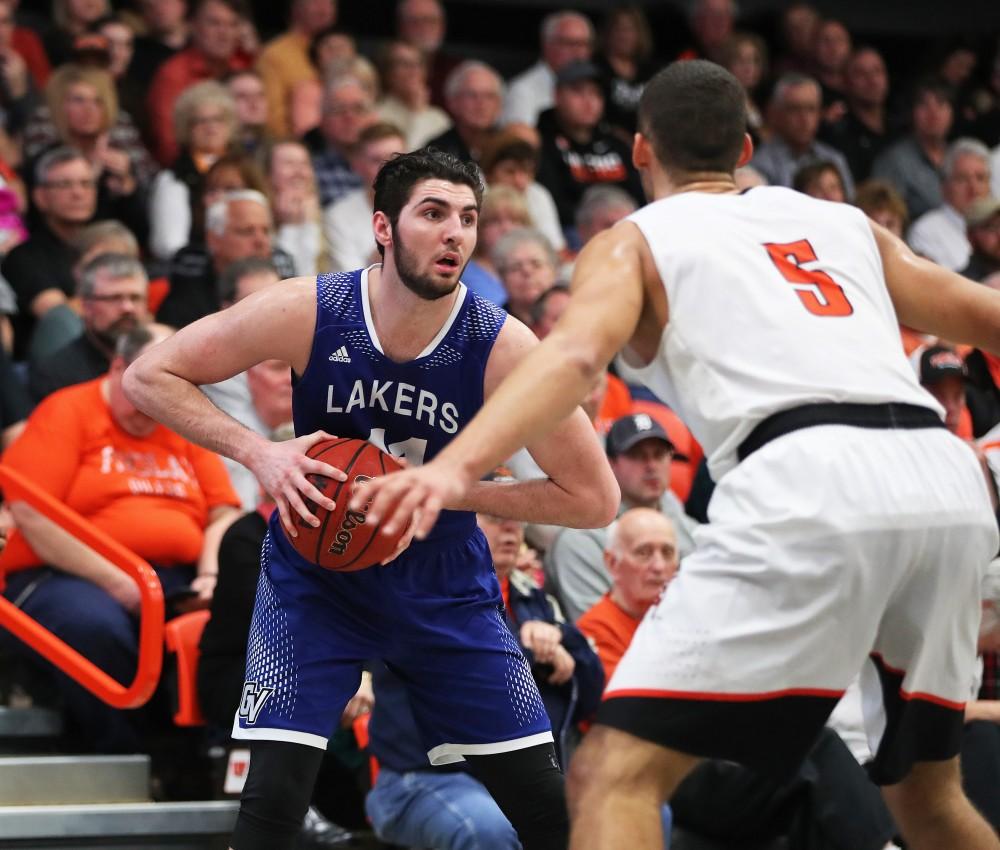 GVL/Kevin Sielaff - Zach West (11) picks up his dribble and looks to pass during the game versus Findlay at the University of Findlay on Tuesday, Feb. 28, 2017.