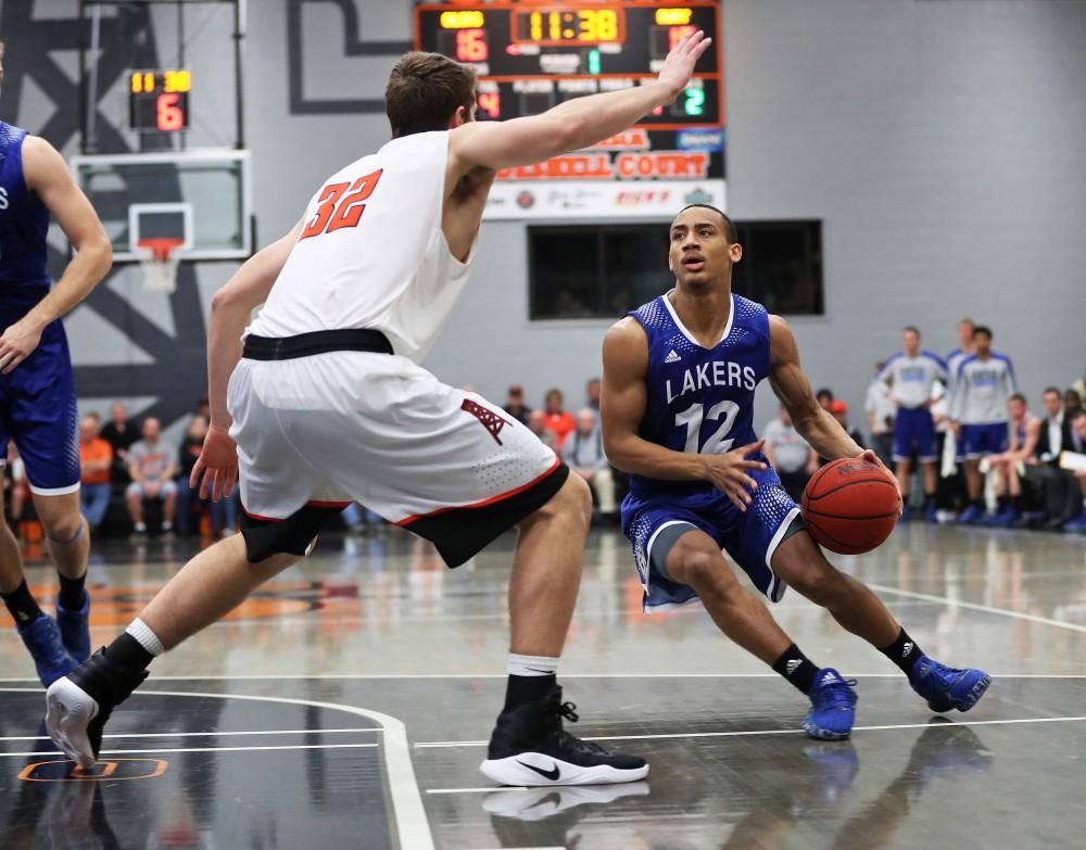 GVL/Kevin Sielaff - Myles Miller (12) moves in to the paint during the game versus Findlay at the University of Findlay on Tuesday, Feb. 28, 2017.