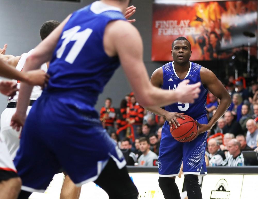 GVL/Kevin Sielaff - Trevin Alexander (5) fires a pass into the paint during the game versus Findlay at the University of Findlay on Tuesday, Feb. 28, 2017.