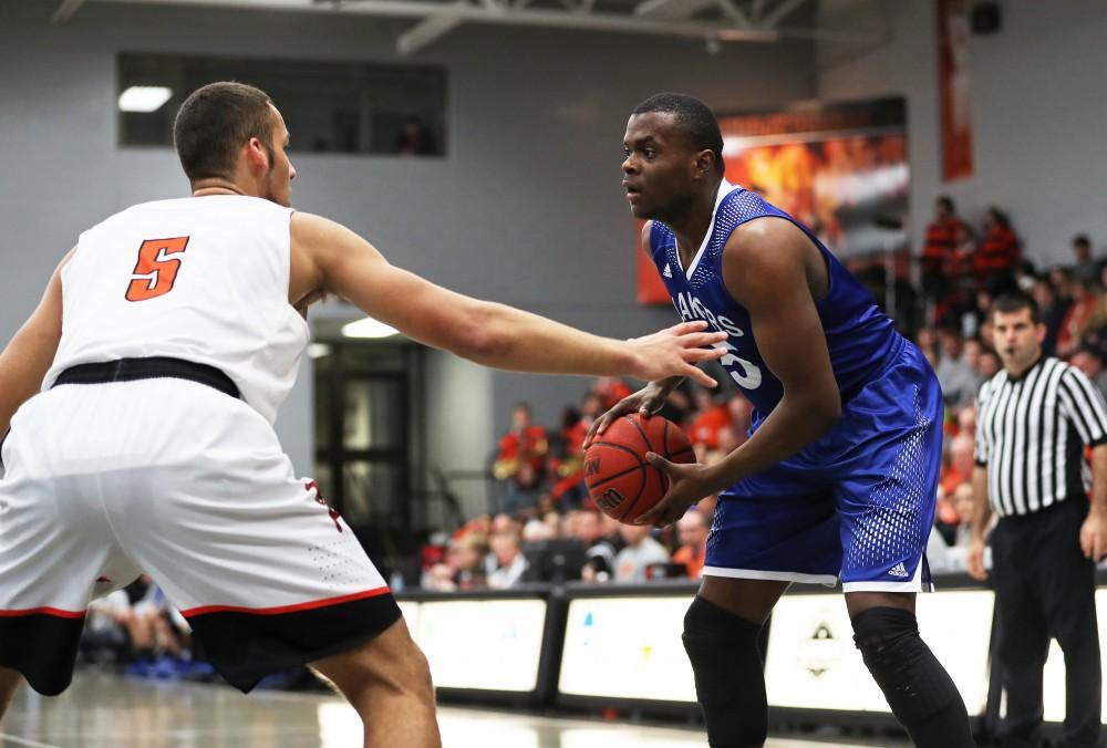 GVL/Kevin Sielaff - Trevin Alexander (5) moves into the paint and looks to pass during the game versus Findlay at the University of Findlay on Tuesday, Feb. 28, 2017.