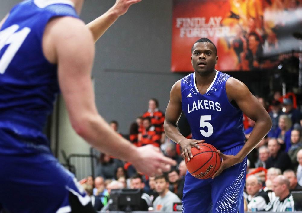 GVL/Kevin Sielaff - Trevin Alexander (5) fires a pass into the paint during the game versus Findlay at the University of Findlay on Tuesday, Feb. 28, 2017.