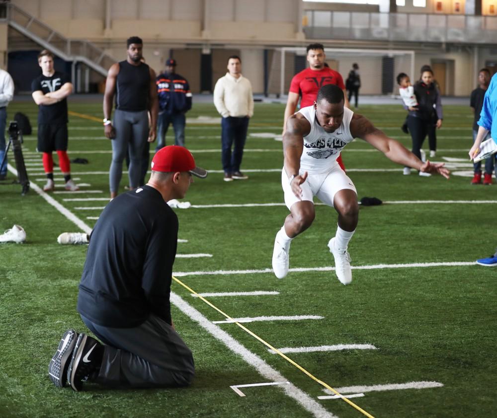 GVL/Kevin Sielaff - Marquez Gollman participates in the broad jump during Pro Day inside the Kelly Family Sports Center on Monday, Mar. 20, 2017.