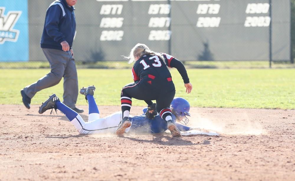 GVL/Kevin Sielaff - Shannon Flaherty (19) slides back to second base during the game vs. Lewis on Tuesday, March 28, 2017.