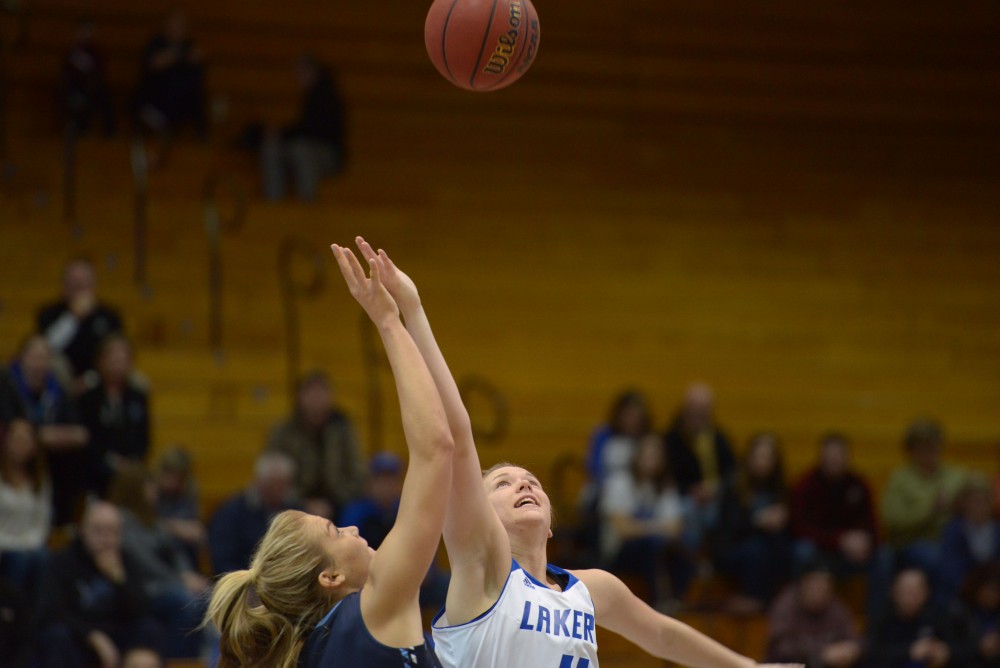 GVL / Luke Holmes - Piper Tucker (11) jumps for the jump ball. GVSU Women’s Basketball defeated Northwood in the Fieldhouse Arena on Tuesday, Feb. 28, 2016.