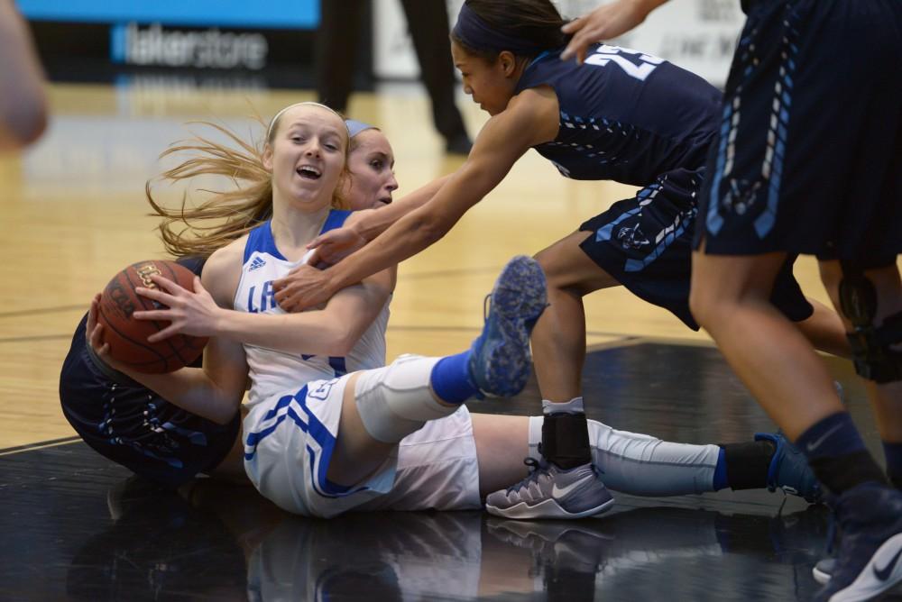 GVL / Luke Holmes - Jenn DeBoer (4) protects the ball. GVSU Women’s Basketball defeated Northwood in the Fieldhouse Arena on Tuesday, Feb. 28, 2016.