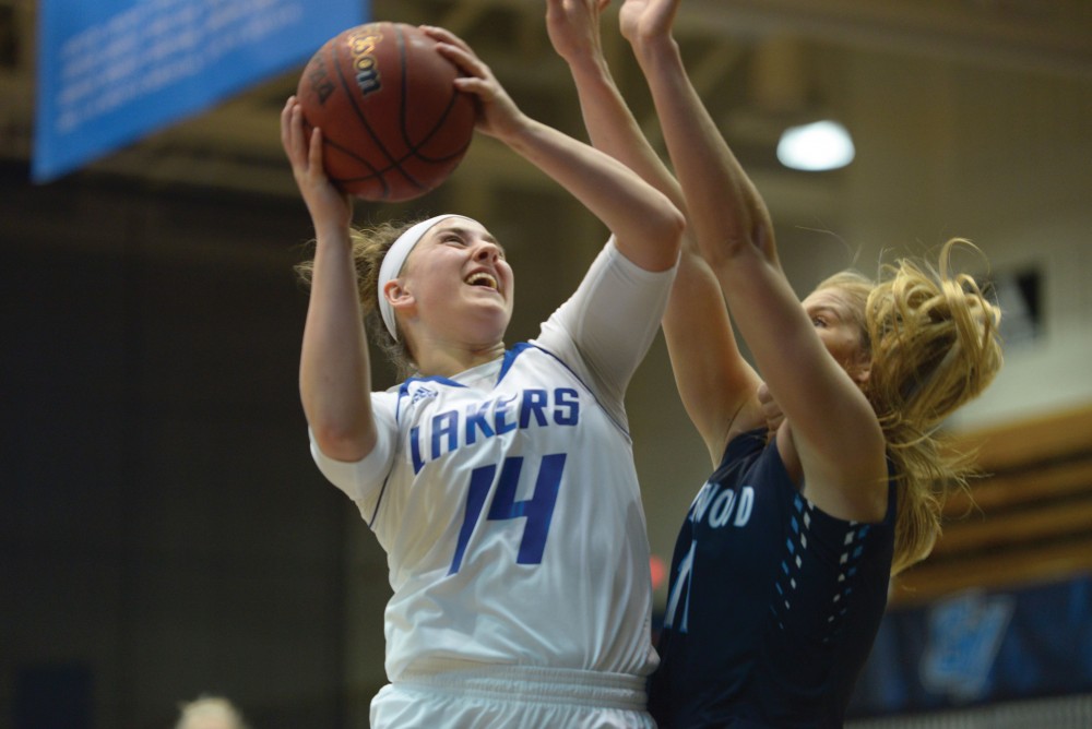 GVL / Luke Holmes - Taylor Parmley (14) takes the ball up. GVSU Women’s Basketball defeated Northwood in the Fieldhouse Arena on Tuesday, Feb. 28, 2016.