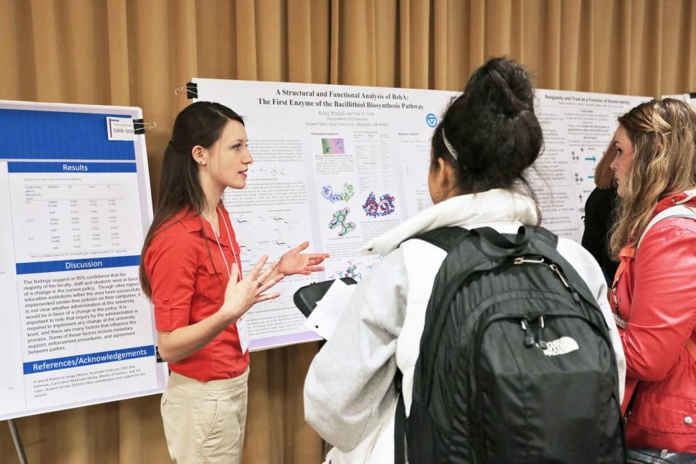 GVL/Kevin Sielaff - Kelsey Winchell (left), presents her work during Student Scholars Day on Wednesday, April 8, 2015 inside of Kirkhofs Grand River Room. 