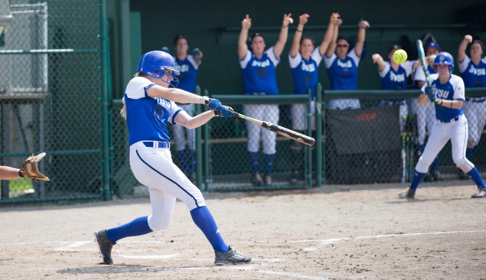 GVL/Kevin Sielaff - Ellie Balbach (11) squares up and hits a home run. Grand Valley State squares off against Wayne State in the second game of the Midwest Super Regional tournament. The Lakers came out with the victory with a final score of 1-0 on Thursday, May 12, 2016 in Detroit, MI. 