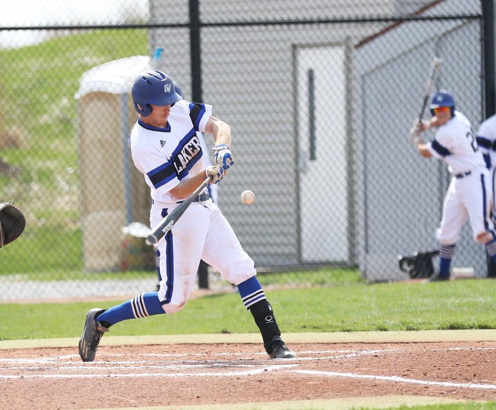 GVL/Kevin Sielaff - Alex Young (12) takes a swing during the game vs. Ashland on Wednesday, April 12, 2017.
