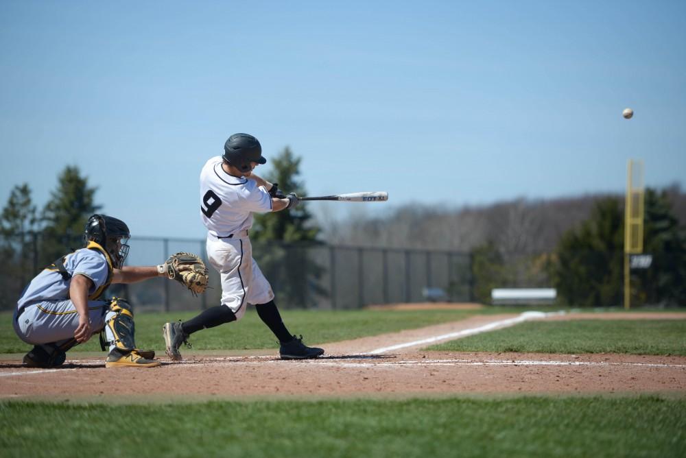 GVL / Luke Holmes -  Josh Smith (9) nails a double. GVSU Men's Baseball faced off against Ohio Dominican in a double header on Saturday, April 8, 2017.