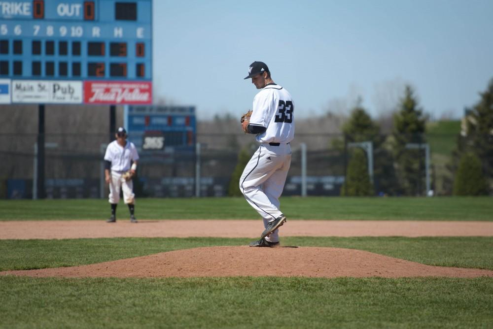 GVL / Luke Holmes - Jake Mason (33) unwinds the pitch. GVSU Men’s Baseball played a double-header against Tiffin University on Saturday, April 1, 2016.