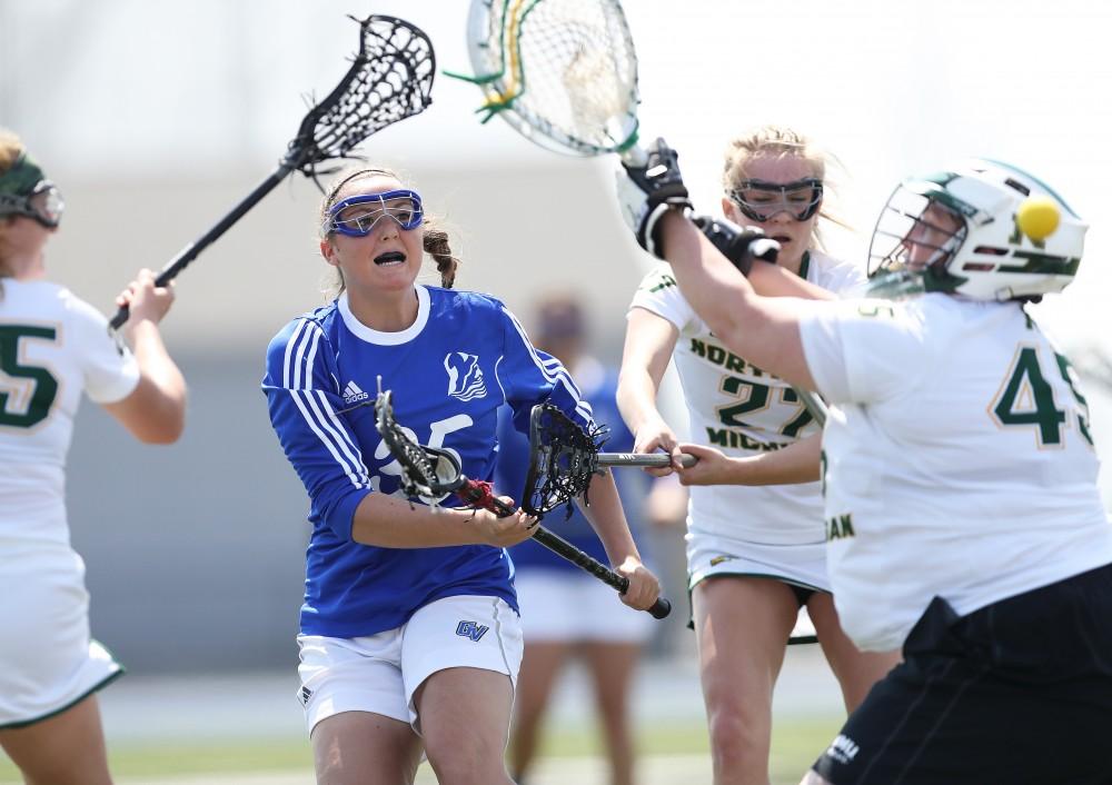 GVL/Kevin Sielaff - Sarah Stagaard (35) tries a shot and beats Northerns goaltender to score during the game vs Northern Michigan on Saturday, April 15, 2017.