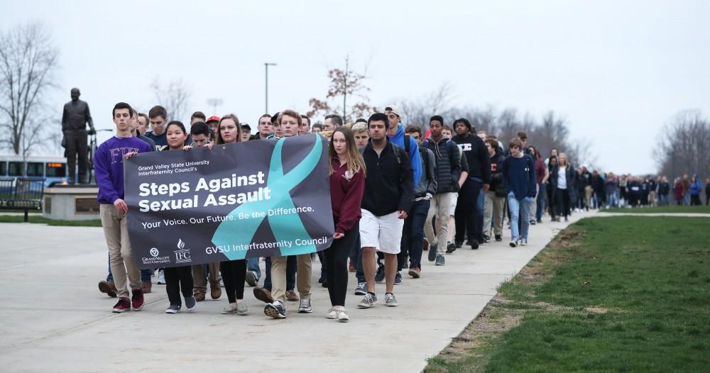 GVL/Kevin Sielaff - Grand Valleys Interfraternity Council holds a silent march around campus against sexual assault on Tuesday, April 11, 2017.