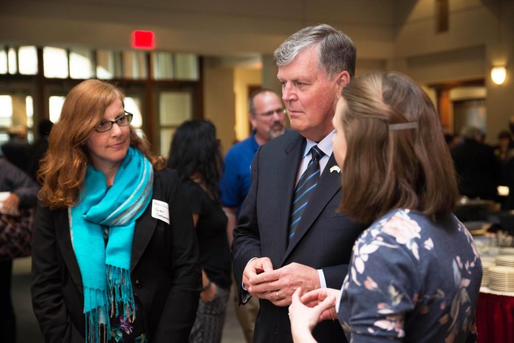 GVL / Luke Holmes - President Haas speaks with a student about the project she runs.The Civic Engagement Showcase was held in the DeVos Center in downtown Grand Rapids on Thursday, April 13, 2017.