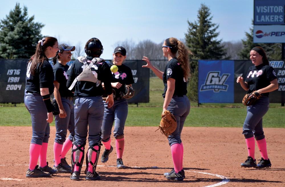 GVL/Hannah Zajac - Players huddle as they finish out their first game on Saturday, April 8, 2017.