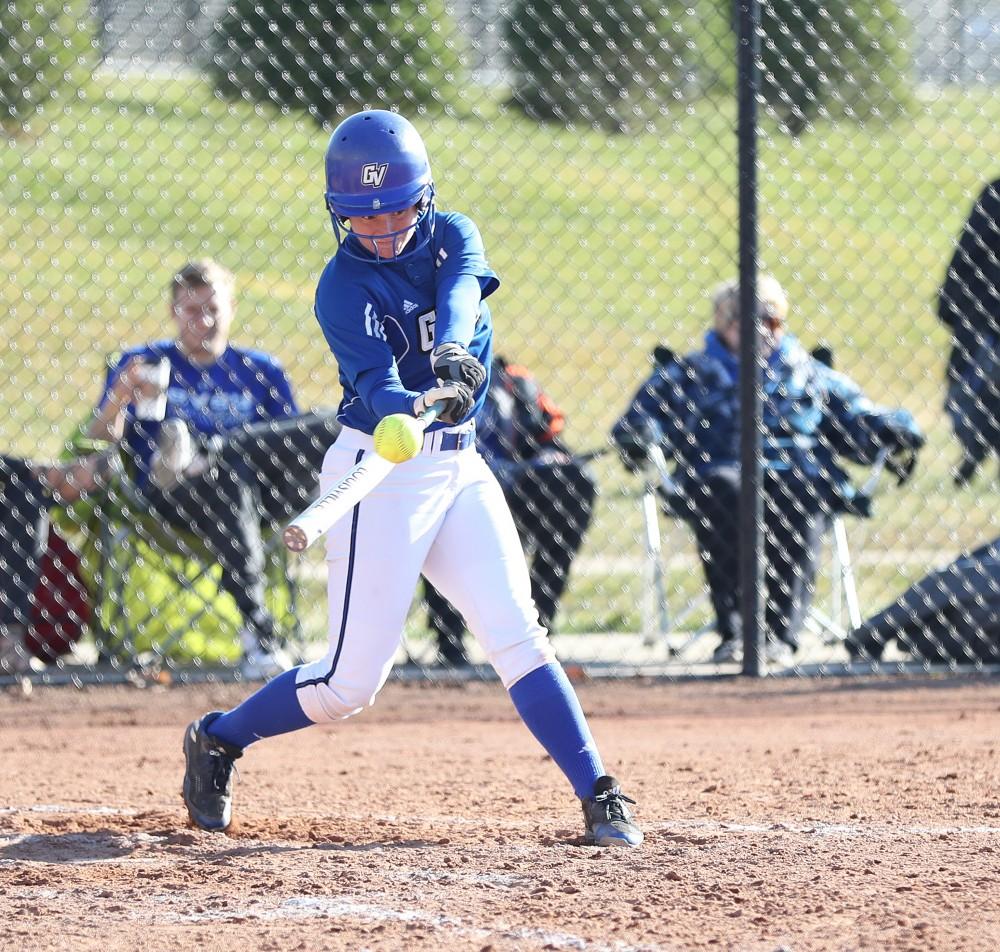 GVL/Kevin Sielaff - Jenna Lenza (4) takes a swing during the game vs. Lewis on Tuesday, March 28, 2017.