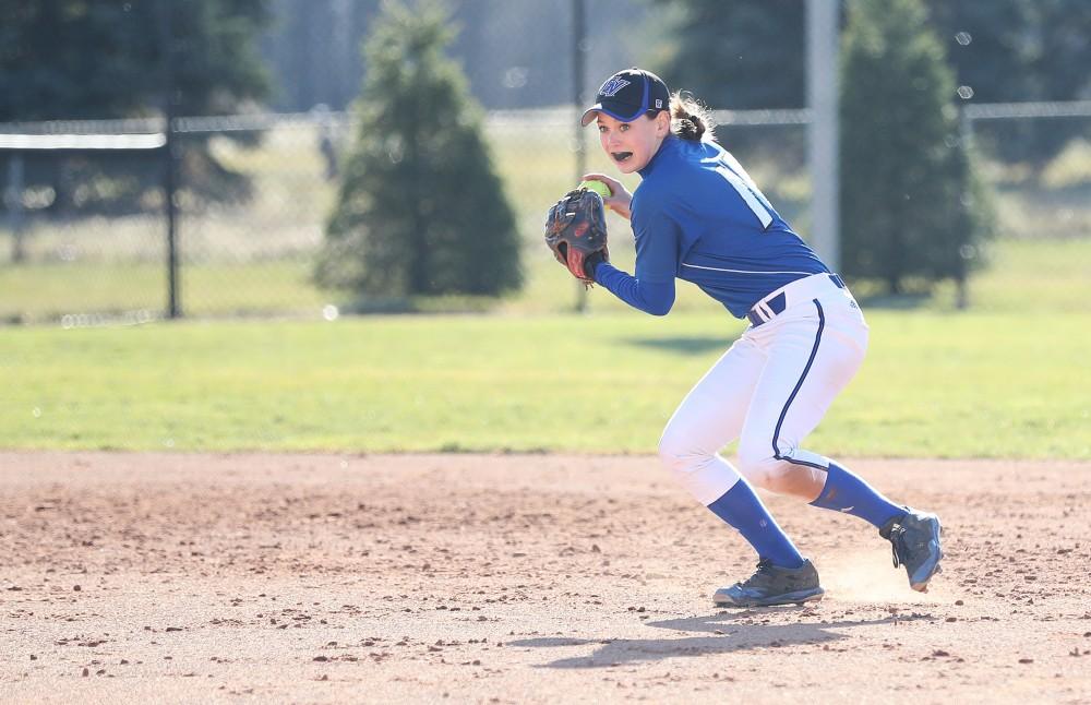 GVL/Kevin Sielaff - Shannon Flaherty (19) throws the ball to first base during the game vs. Lewis on Tuesday, March 28, 2017.