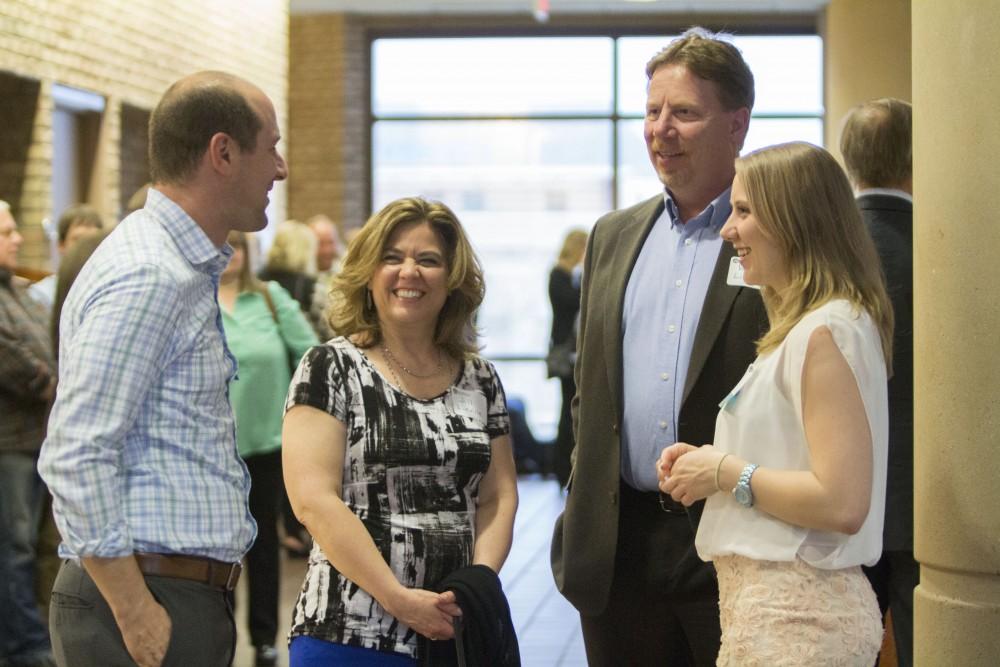 GVL/Mackenzie Bush - Family, friends, professors, and faculty come together to celebrate GVSU students. The Student Awards Convocation Ceremony was held in the Eberhard Center Monday, April 10, 2017. 