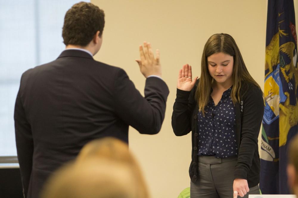 GVL/Mackenzie Bush - Jonathan Bowman takes the oath after being elected President of Student Senate for the 2017-2018 school year, given by former President, Ella Fritzmeier. The Student Senate elections took place Thursday, April 14, 2017. 