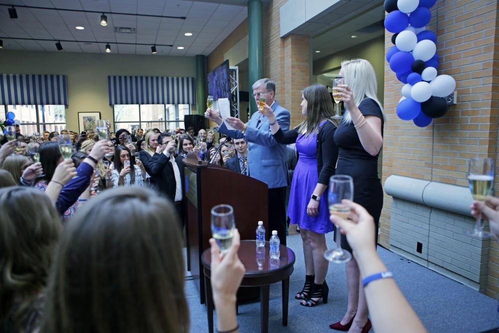 GVL / Emily Frye
President Thomas Haas, Ella Fritzemeier, and Sarah Daniels toast with the class of 2017 on Wednesday April 19, 2017.