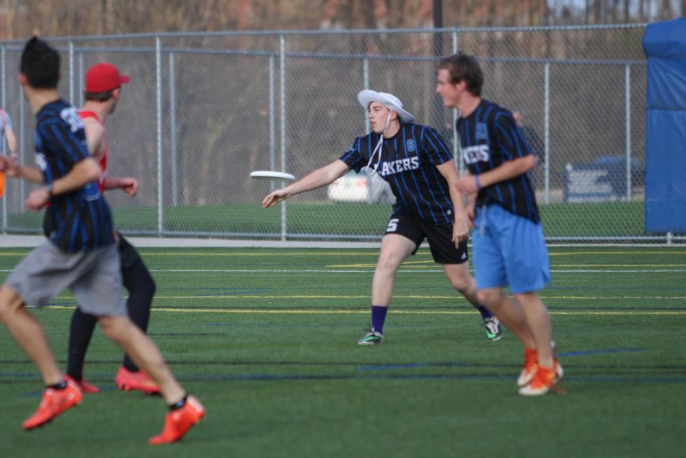 GVL/Mackenzie Bush - GVSU player throws the frisbee during the Ultimate Frisbee game against Ferris Monday, April 17, 2017. 
