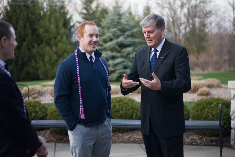 GVL / Luke Holmes -  President Haas speaks with one of the veterans. The Student Veterans gala was held in the Alumni House on Saturday, April 8, 2017.