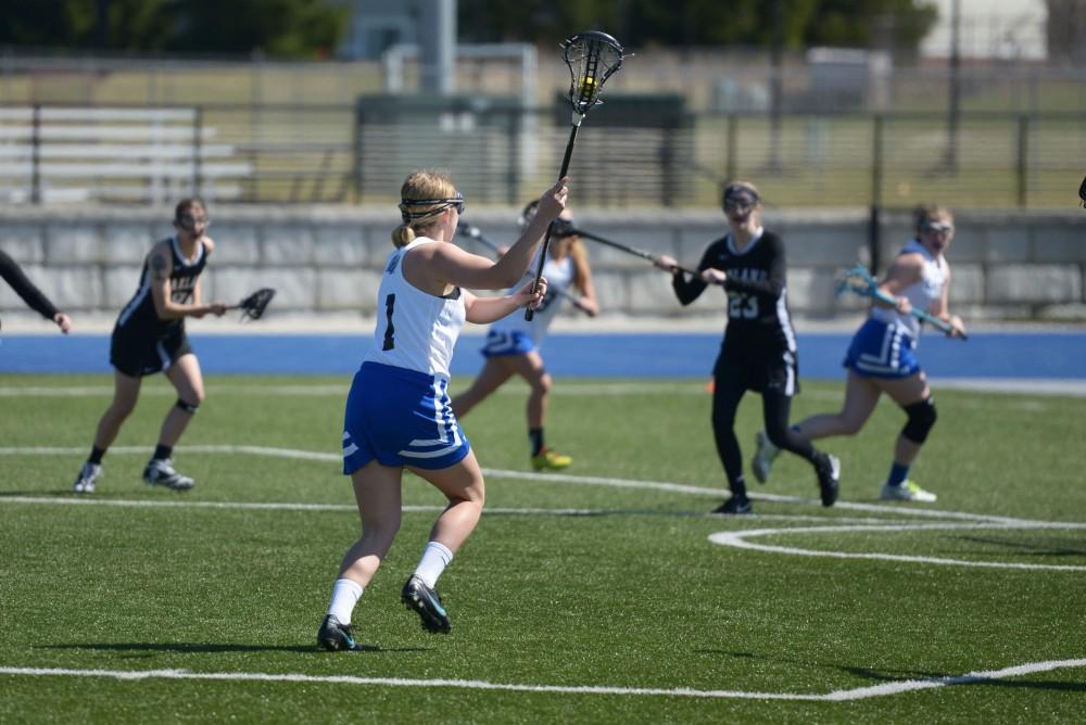 GVL / Luke Holmes - Abbie Waechter (1) makes the play. Women’s Lacrosse played against Oakland University on Saturday, April 1, 2016.