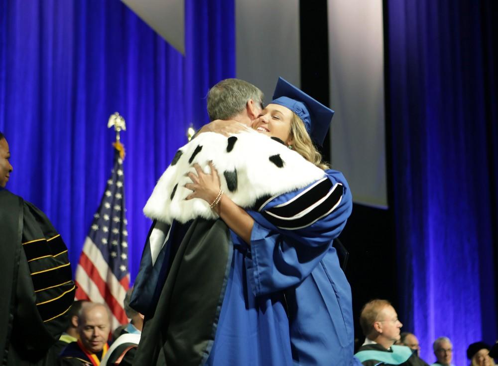 GVL / Emily Frye
Grand Valley State Univeristy student Alex Taylor hugs President Haas as she recevies her diploma during graduation on Saturday April 29, 2017.