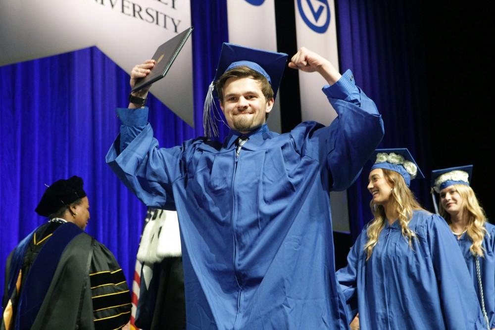 GVL / Emily Frye
Grand Valley State Univeristy student Patrick Mast celebrates receiving his diploma during graduation on Saturday April 29, 2017.