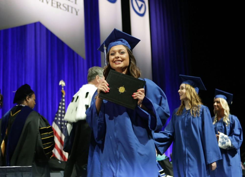 GVL / Emily Frye
Grand Valley State Univeristy student Tori Witnauer celebrates receiving her diploma during graduation on Saturday April 29, 2017.