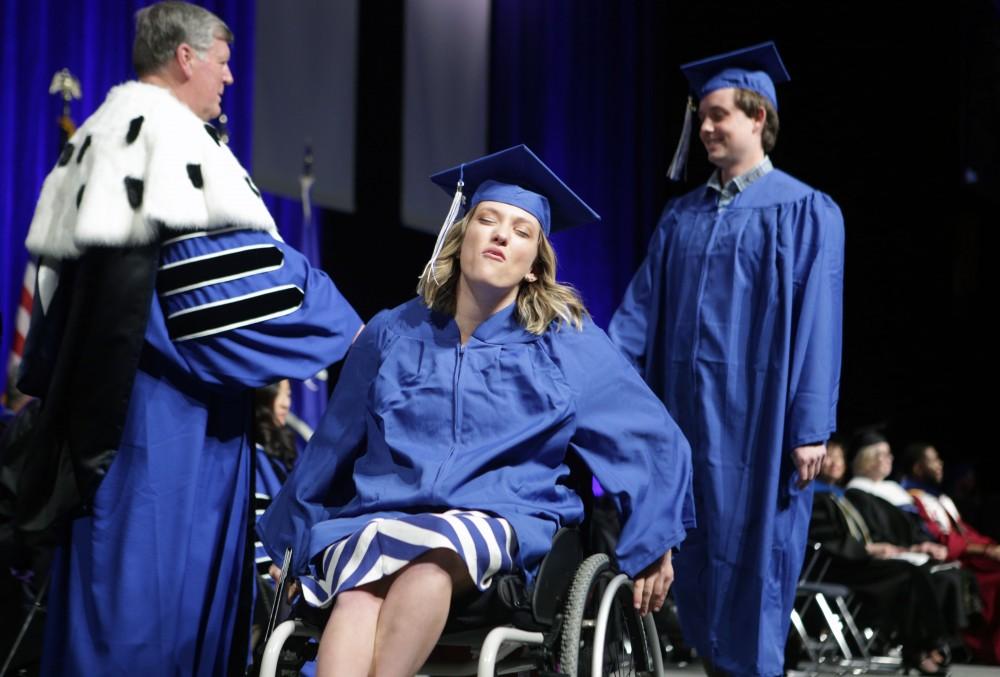 GVL / Emily Frye
Grand Valley State Univeristy student celebrates receiving her diploma during graduation on Saturday April 29, 2017.