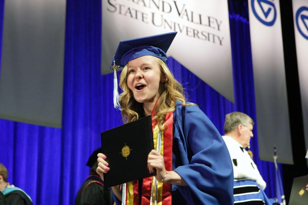 GVL / Emily Frye
Grand Valley State Univeristy education student Stephanie Smith celebrates receiving her diploma during graduation on Saturday April 29, 2017.