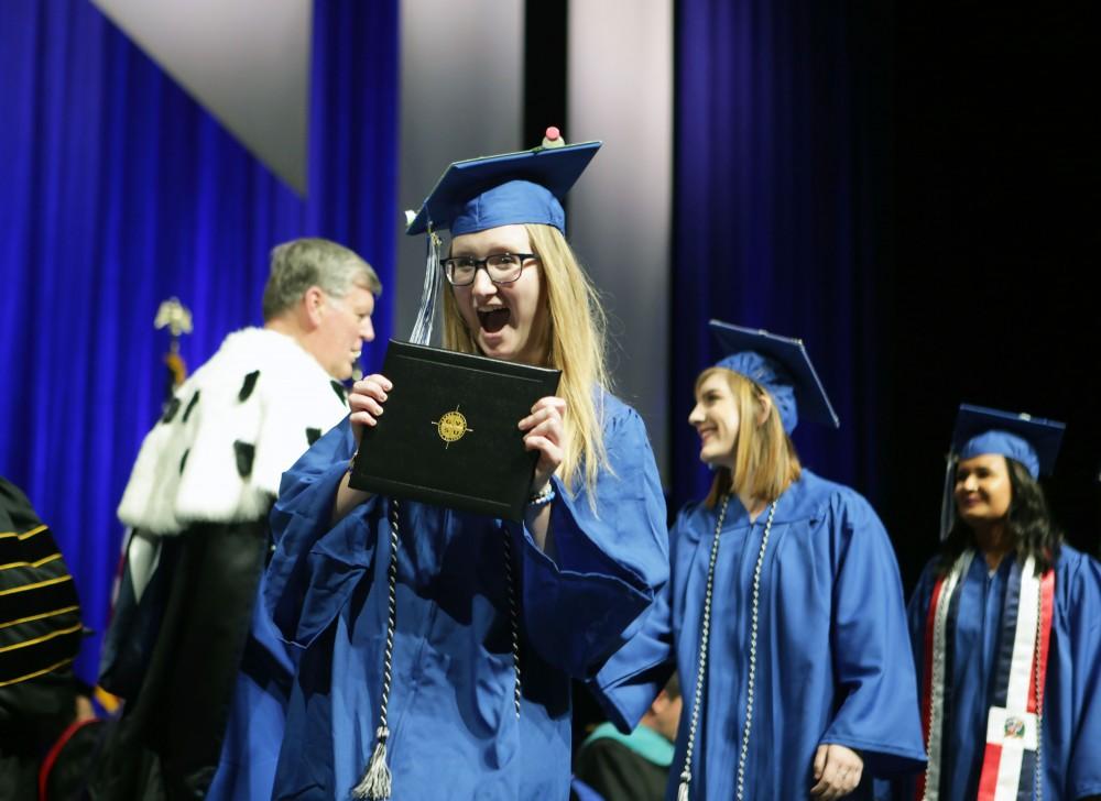 GVL / Emily FryeGrand Valley State Univeristy student Jessica Hodge celebrates receiving her diploma during graduation on Saturday April 29, 2017.