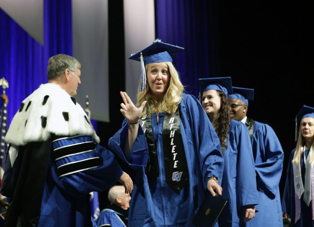 GVL / Emily FryeGrand Valley State Univeristy student celebrates receiving her diploma during graduation on Saturday April 29, 2017.