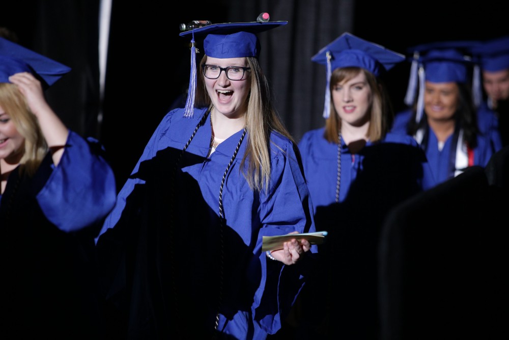 GVL / Emily FryeGrand Valley State Univeristy student Jess Hodge celebrates receiving her diploma during graduation on Saturday April 29, 2017.