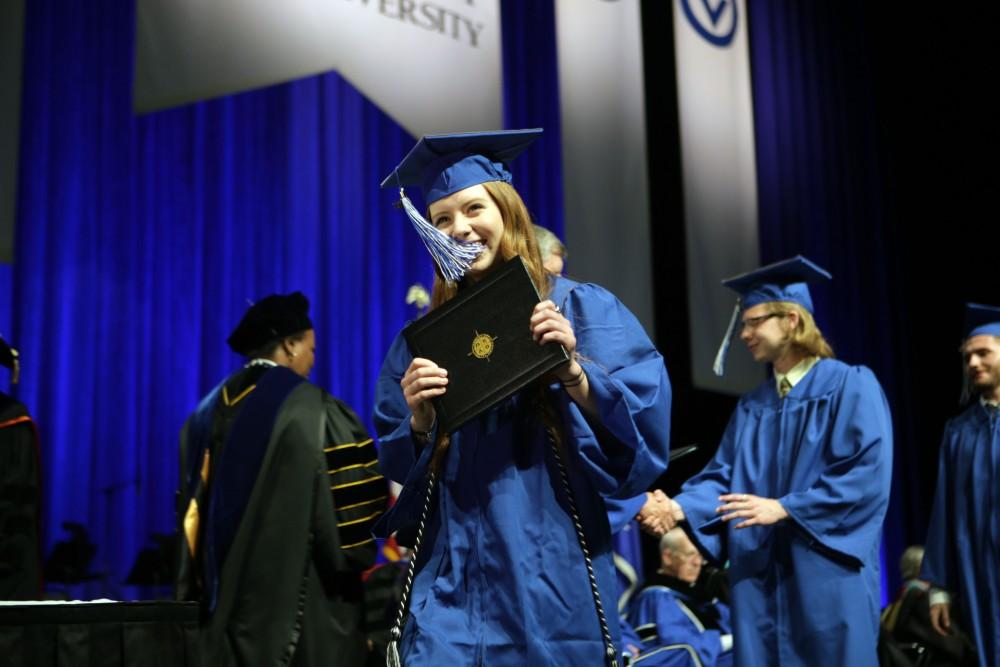 GVL / Emily FryeGrand Valley State Univeristy design student Jordinn West celebrates receiving her diploma during graduation on Saturday April 29, 2017.