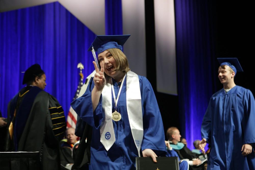 GVL / Emily FryeGrand Valley State University student Julie Nichols celebrates receiving her diploma during graduation on Saturday April 29, 2017.