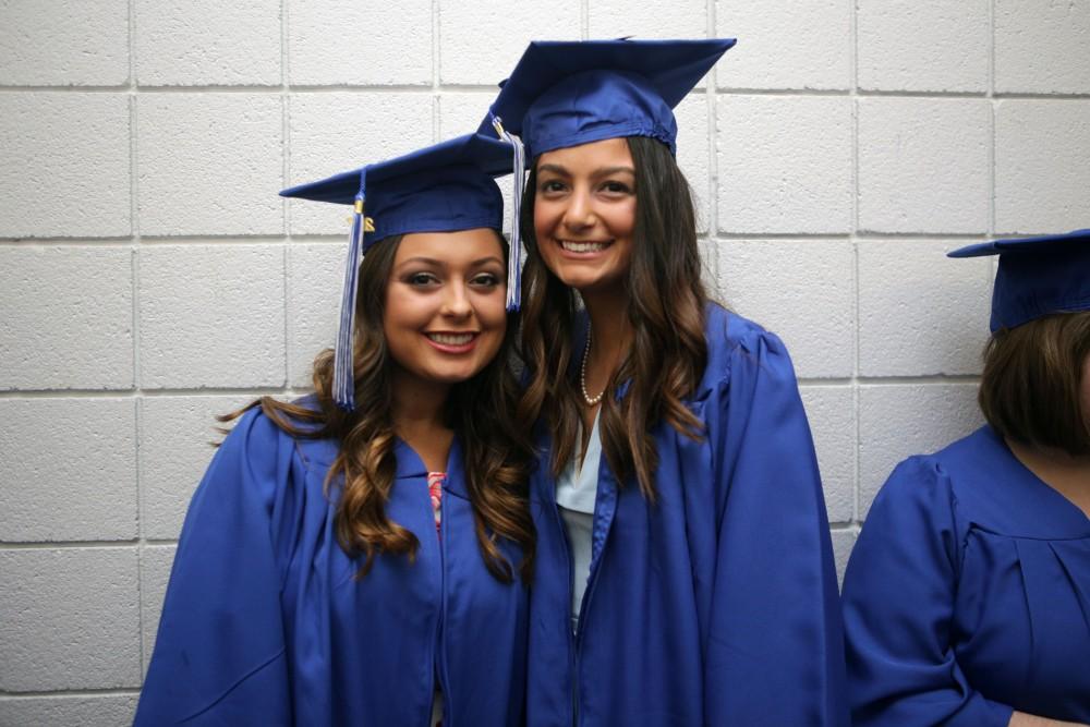 GVL / Emily FryeGrand Valley State University students Victoria Witnauer and Gabriella Barbieri before graduation on Saturday April 29, 2017.